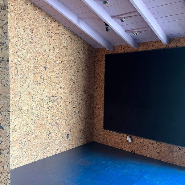 Cobblestone Black cork wall tiles on tv room wall
